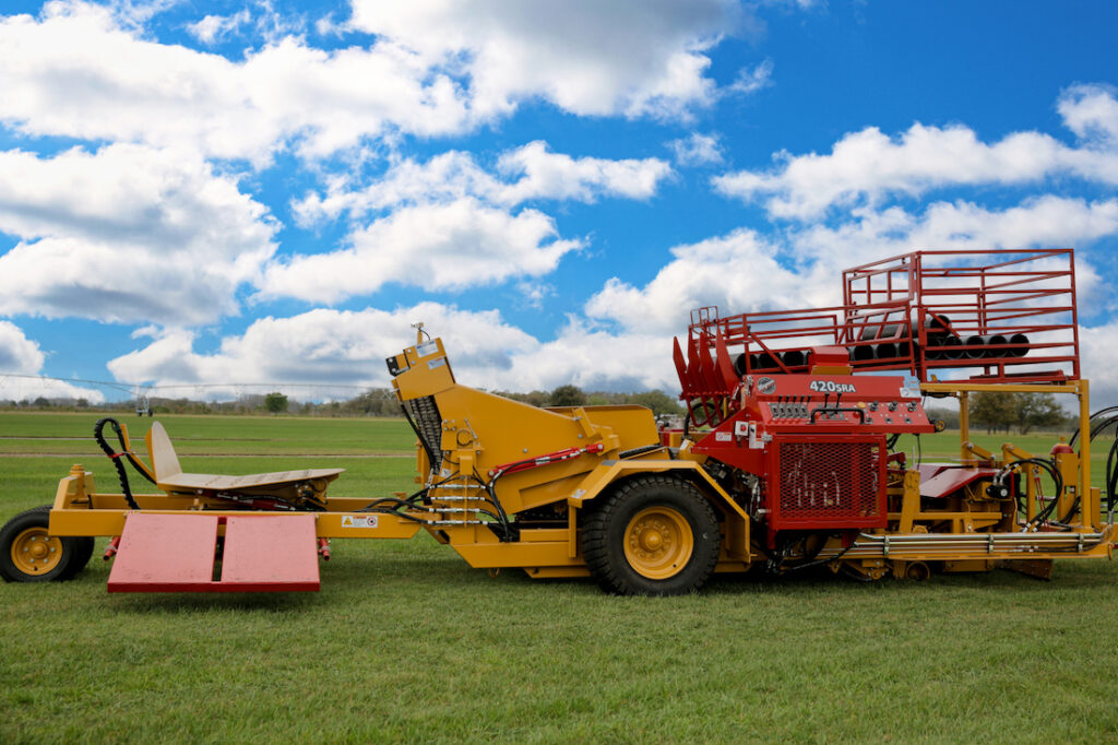 A side view of the Magnum SRA machine that requires regular farm equipment maintenance.