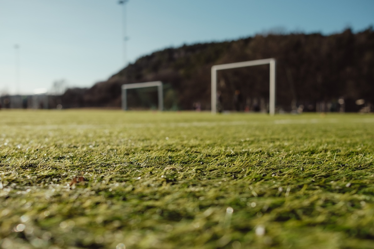 A wide shot of a soccer field that has benefited from sports turf management.