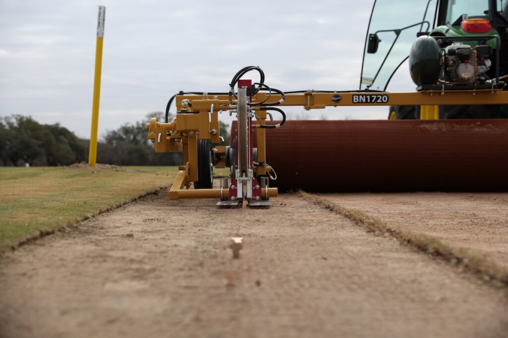 The BN-1720 Field Net Installer for installing sod netting shown with Field Net Stakers.